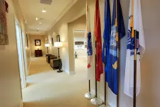 Thumbnail for a hallway with flags