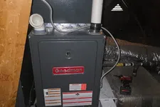 Thumbnail for AC Maintenance, Cleaning and Tune-up in Johns Creek by The Air Company of GA. Goodman furnace and GeneralAire air purifier installed in attic with ductwork and air filter nearby.