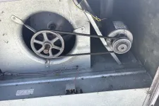 Thumbnail for Metal HVAC blower fan system with motor and belt drive inside an industrial unit.
