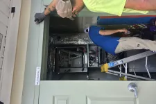 Thumbnail for Two technicians inspect HVAC equipment in a mechanical room labeled Mechanical 3 with a ladder nearby.