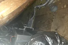 Thumbnail for HVAC unit with ducts installed in an attic with wooden beams and insulation