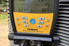 Thumbnail for Fieldpiece SMAN refrigerant manifold gauge displaying pressure and temperature readings on HVAC unit.