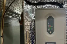 Thumbnail for AC Repair in Roswell GA by The Air Company of GA. Honeywell Home HZ321 whole-house humidifier control unit mounted on reflective insulation panel.