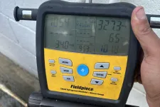 Thumbnail for Fieldpiece SMAN refrigerant manifold with micron gauge displaying pressure and temperature readings.