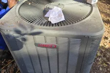 Thumbnail for Residential AC Heat Repair in Marietta 30068 by The Air Company of GA.  Outdoor Lennox air conditioning unit with tools and technician working nearby in a garden setting.