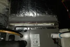 Thumbnail for Furnace unit with insulated ductwork and connected PVC pipes in a basement HVAC system