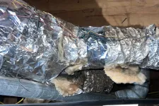 Thumbnail for Smyrna AC Cooling Repair in Atlanta 30080 by The Air Company of GA. Insulated HVAC ductwork with foil wrap and exposed wooden ceiling beams in attic space.