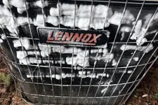 Thumbnail for Lennox air conditioning unit being cleaned with white foam detergent on the front grill outdoors.