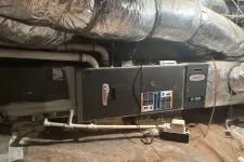 Thumbnail for Lennox HVAC unit installed in a basement with insulated ductwork and PVC piping