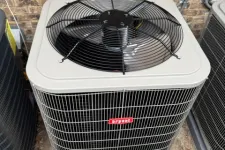 Thumbnail for Bryant brand outdoor air conditioning unit with protective fan grill