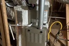 Thumbnail for Bryant furnace unit installed in an attic with insulated ductwork and ventilation pipes