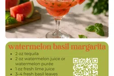 Thumbnail for Watermelon basil margarita in a glass garnished with watermelon slice and basil on marble surface.