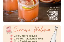 Thumbnail for Two Cincoro Paloma cocktails with grapefruit wedges and salted rims on a wooden table with grapefruit slices in background.