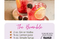 Thumbnail for Two Bramble cocktails with blackberries, lemon slices, and crushed ice served on a white tray.