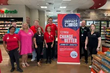 Thumbnail for a group of people posing for a photo in a store