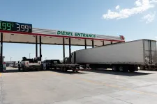 Thumbnail for a group of trucks parked at a gas station