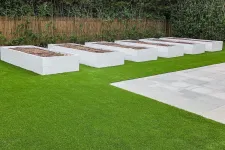 Thumbnail for a group of white boxes on a grass lawn