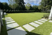 Thumbnail for a large green lawn with white stones