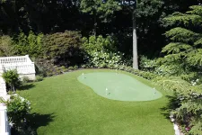 Thumbnail for a large green lawn with a pond
