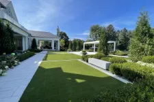 Thumbnail for a large green lawn with a house in the background