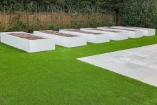 Thumbnail for a large green lawn with white boxes