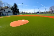 Thumbnail for a baseball field with a red and white ball in the middle