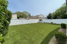 Thumbnail for a fenced yard with a white fence and a white picket fence