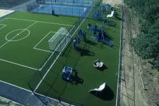 Thumbnail for a football field with a car parked on the side