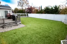 Thumbnail for a backyard with a white fence