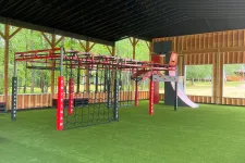 Thumbnail for a large green and red playground