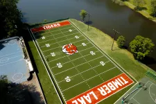 Thumbnail for a football field with a red car