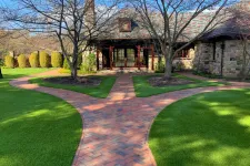 Thumbnail for a brick driveway leading to a house
