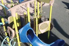 Thumbnail for a playground with yellow and blue playground equipment