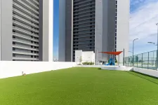 Thumbnail for a green lawn in front of a building