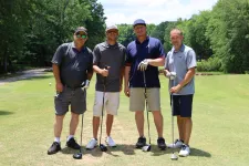 Thumbnail for a group of men standing on a golf course