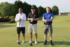 Thumbnail for a group of men standing on a golf course