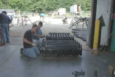 Thumbnail for a group of men working on a machine