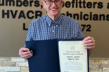Thumbnail for Denton Cooley holding a certificate