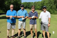 Thumbnail for a group of men holding golf clubs