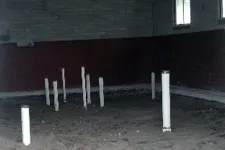 Thumbnail for a row of white poles in front of a building
