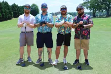 Thumbnail for a group of men posing for a picture on a golf course