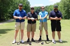 Thumbnail for a group of men on a golf course