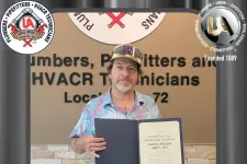 Thumbnail for a person holding a certificate