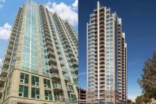 Thumbnail for Two modern high-rise residential buildings with glass windows and balconies against blue sky.