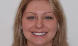 Thumbnail control image for Smiling woman with light skin, blue eyes, and blonde hair against a plain white background.
