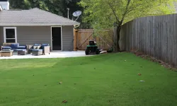 Thumbnail control image for a lawn with a tractor and a house in the background