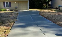 Thumbnail control image for a driveway with a yellow tape on the side and a house in the background