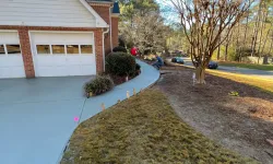 Thumbnail control image for a house with a driveway and a lawn with a house and trees