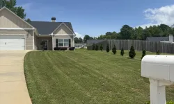 Thumbnail control image for a yard with a fence and a house in the background