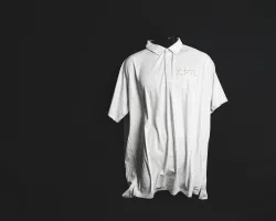 a white t-shirt on a black background